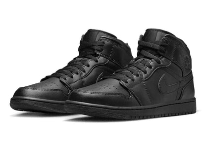 Black Air Jordan 1 Mid Trainers by Nike